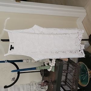 Alfani halter top, white floral crochet.   Lined with raw crochet hem size 12